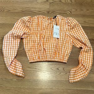 Zara orange pullover shirt.